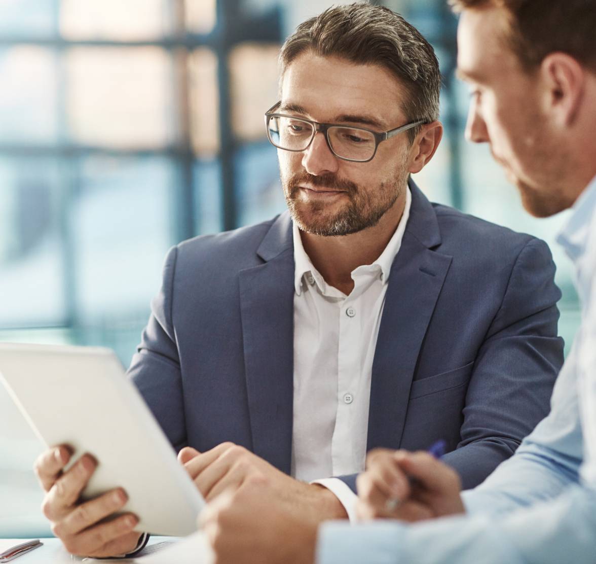 office-man-with-glasses-looking-at-tablet